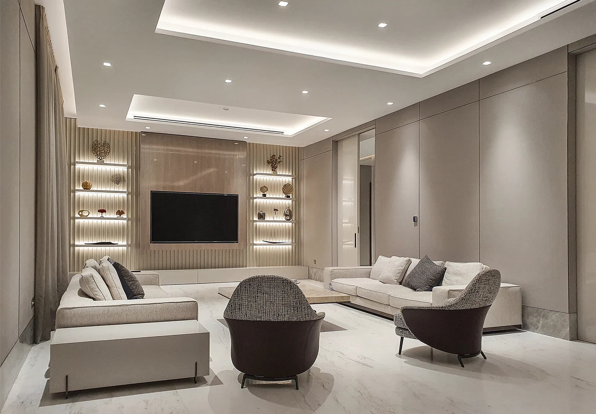 Family room with cream sofas, a timber TV wall and lit shelving — Persian Gulf Coast Villa, Abu Dhabi