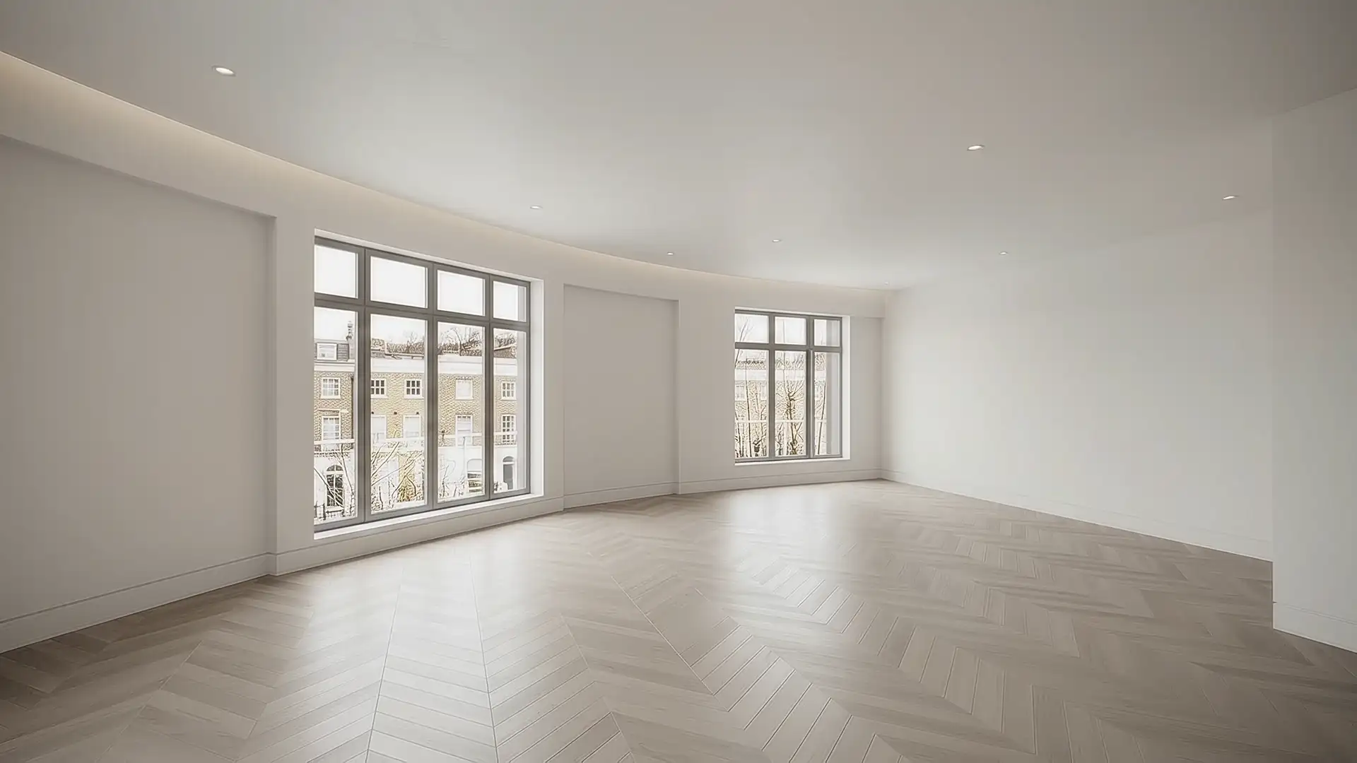 An empty, unfurnished living room before the design